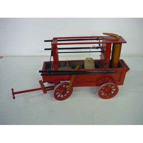 109 - Handmade wooden model of a Victorian fire engine, with spoked wheels (37cm x 22cm)