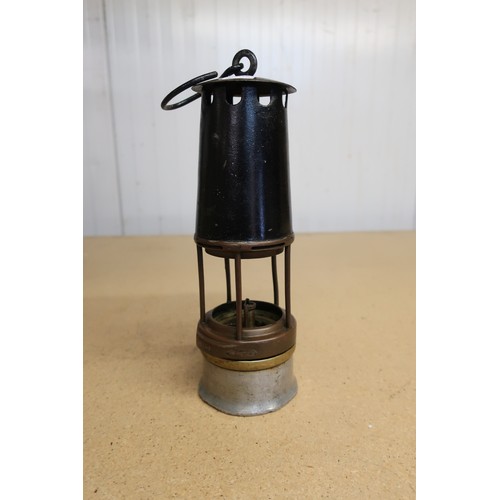 48 - Brass and steel miners lamp stamped HE (22cm); a brass, steel and alloy Patent 953984 miners lamp (2... 