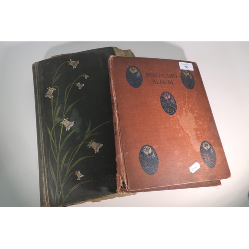 263 - Two postcard albums containing an extremely large quantity of various assorted postcards, mostly bla... 