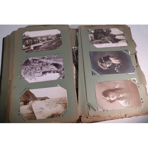 263 - Two postcard albums containing an extremely large quantity of various assorted postcards, mostly bla... 