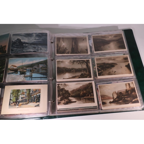 264 - A postcard album with internal date 1906 containing an extremely large quantity of various assorted ... 