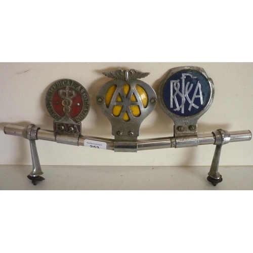 253 - Chrome car badge bar with British Medical Association, AA and another car badge (length 40cm)