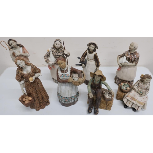 19 - Group of eight studio pottery figures of various countryside ladies, carrying produce, including a s... 