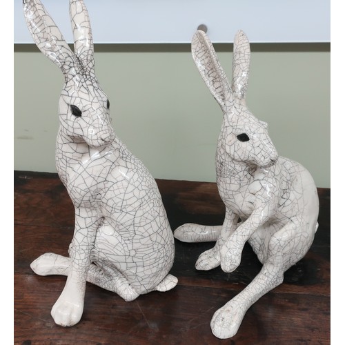 1 - Pair of Raku ware style crackle glazed seated Arctic hares (approx height 47cm)