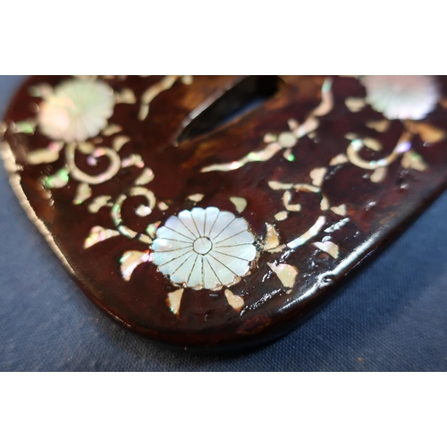 61 - Japanese Shibayama Tsuba of Kaku-maru-gata shape, the wooden core with brown lacquer and mother of p... 