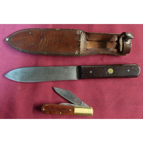 65 - Vintage skinning knife with 5 inch steel blade, with wooden grip in leather sheath, and a twin blade... 