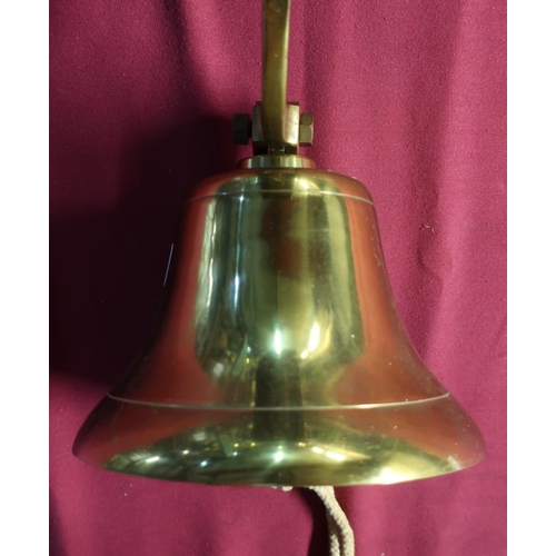 84 - Modern brass hanging ships type bell with clanger, mounted on to rectangular wooden wall plaque, wit... 