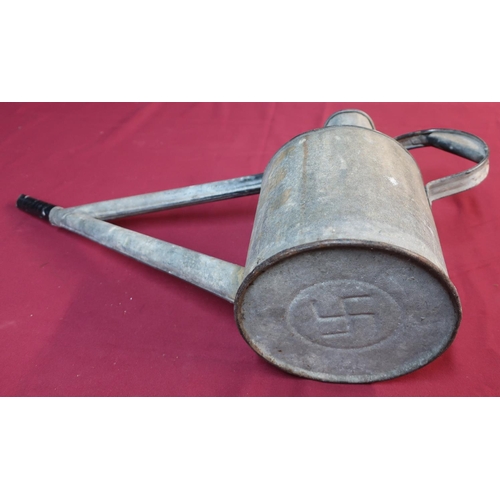93 - Galvanised long spouted watering can, the base with impressed swastika mark (height 28cm)