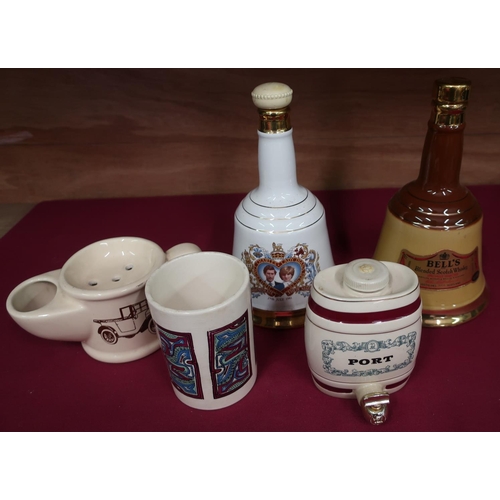 15 - Seven Bells Whisky decanters, four Wade commemorative whisky decanters and three shaving mugs