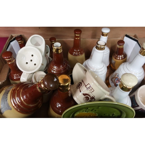 15 - Seven Bells Whisky decanters, four Wade commemorative whisky decanters and three shaving mugs