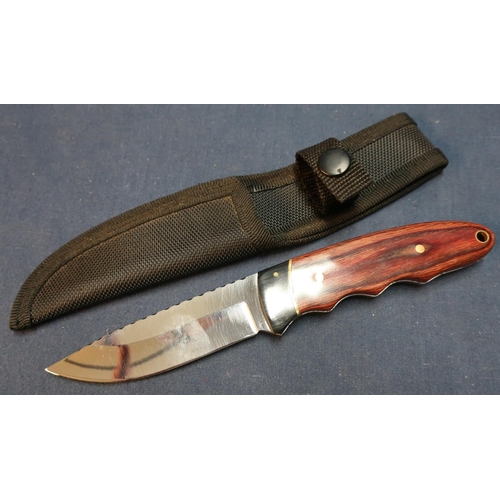 138 - Sheath knife with 4 inch blade and 2 piece wooden grips complete with belt sheath
