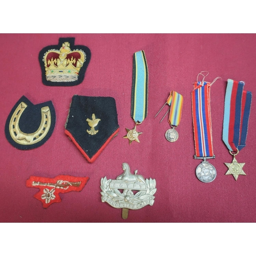 103 - 1939 - 45 miniature war medal and similar star, various embroidered military badges, miniatures etc
