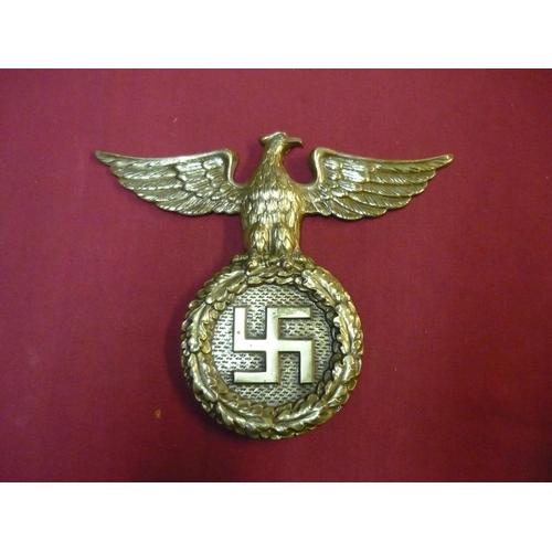 128 - Large German Third Reich cast alloy eagle above swastika plaque (20.5cm x 25cm) with traces of gilt ... 