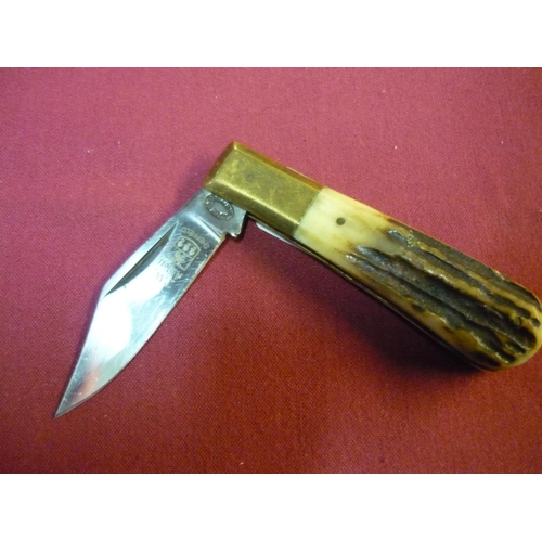 135 - Single bladed pocket knife by T. W. Ablett of Sheffield with two piece antler grips and brass mounts... 