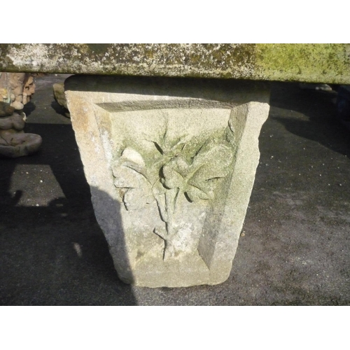 10 - Stone seat on carved floral supports (61