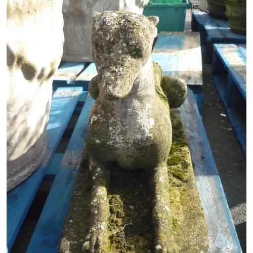 11 - Stone well weathered figure of a laying whippet
