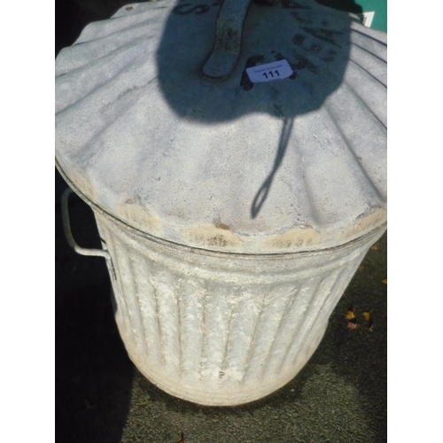 109 - Galvanised dustbin containing plant pots and an extra lid