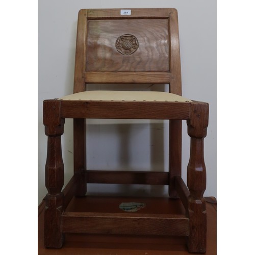 44 - Yorkshire oak childs chair, panel back carved with a Yorkshire rose, brass nail upholstered seat, on... 