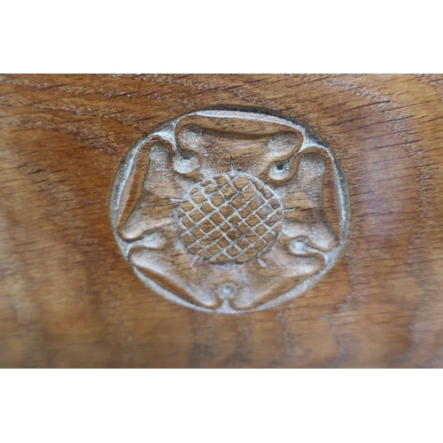 44 - Yorkshire oak childs chair, panel back carved with a Yorkshire rose, brass nail upholstered seat, on... 