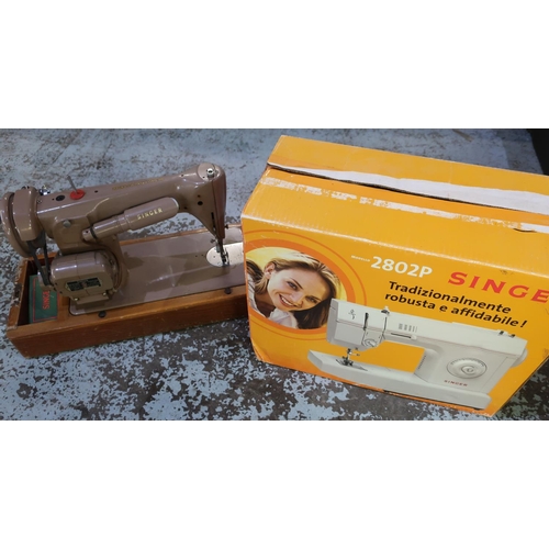 323 - Singer 2802 P Electric Sewing Machine in original box and packaging with instructions, and a vintage... 