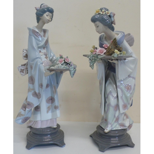 46 - Pair of large Lladro figures of Japanese females with trays of flowers, (H34cm) (2)