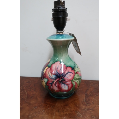 50 - Moorcroft Hibiscus pattern mallet shaped table lamp, with impressed mark and part of old label, (24.... 