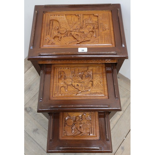29 - Nest of three eastern hardwood tables with carved tops