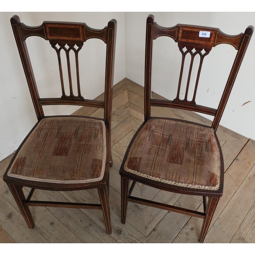 259 - Pair of Edwardian mahogany inlaid chairs, on square tapering supports and upholstered seats (2)