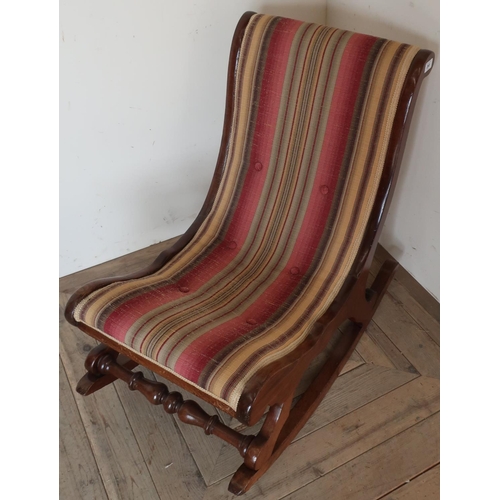 260 - Late Victorian mahogany framed rocking chair, with turned cross supports