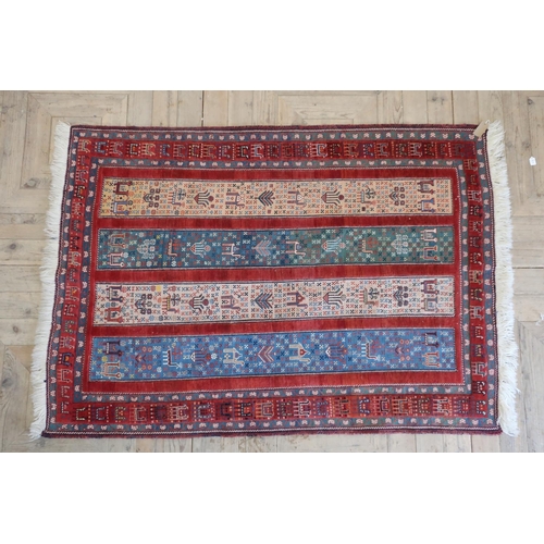 100A - Caucasian multicoloured rug, the four stripe field filled with animals and foliage within a repeatin... 