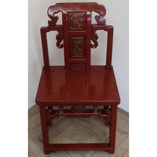 95 - Chinese Cheching red lacquered elm chair with pierced and carved back, solid seat with pierced friez... 