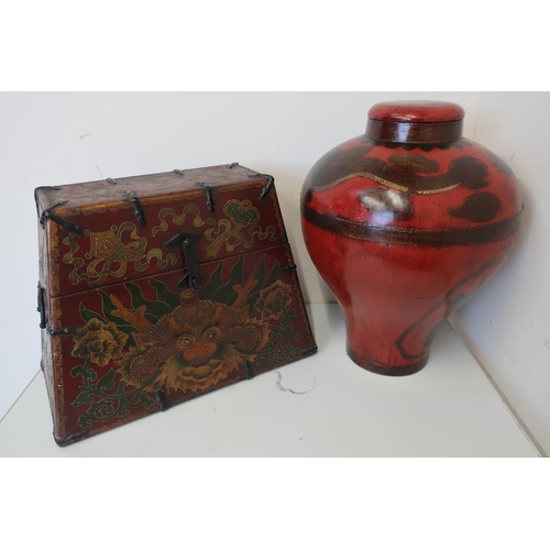 98 - Chinese lacquered style rectangular tapering box, decorated with a dragon, with two metal handles an... 