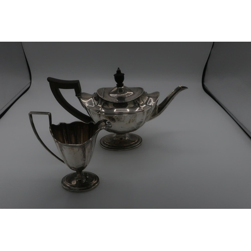 117 - Edwardian hallmarked silver teapot, shaped oval body with ebonised handle and finial on tapered oval... 