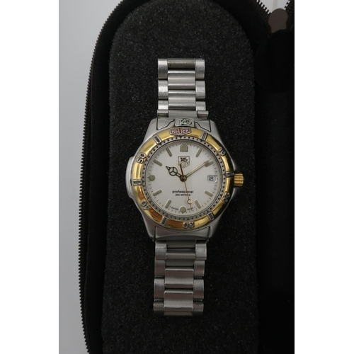 53 - Ladies Tag Heuer professional 200 stainless steel quartz wrist watch, with baton numerals and date, ... 
