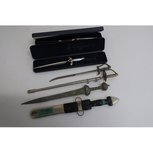 373 - Letter knife in the form of Victorian officers dress sword, and five others (6)