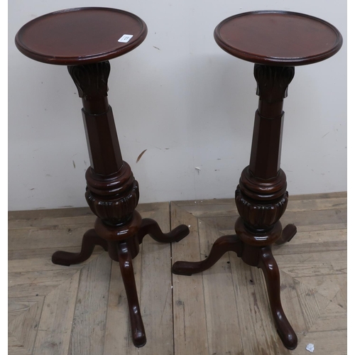 429 - Pair of mahogany tripod torchere, dish turned tops on faceted supports with three splayed legs (84cm... 