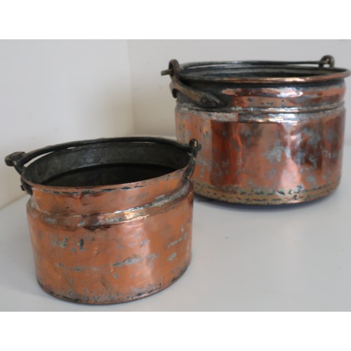 80 - Graduated pair of Eastern brass and copper circular pans with snake scroll handles (diameter 58cm) (... 