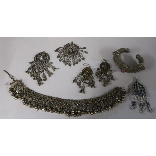 72A - Collection of Yemeni silver jewellery incl. a pair earrings and a pendant, two similar pendants, a s... 