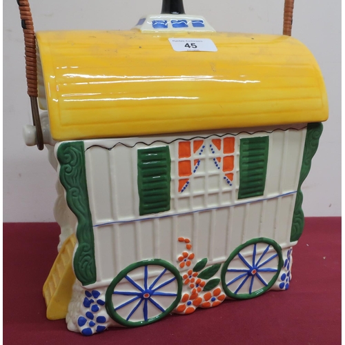 45 - Old Romany bone china biscuit barrel in the shape of a bow top gypsy caravan, with wicker bound hand... 