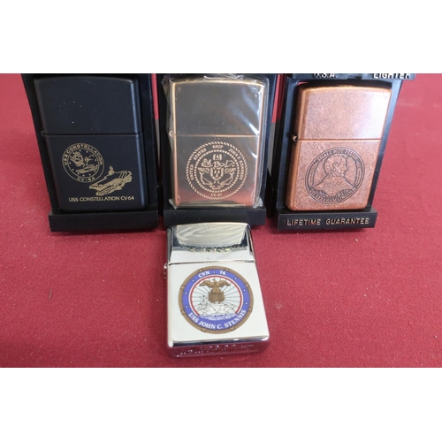 115 - Four United States Navy themed commemorative lighters 