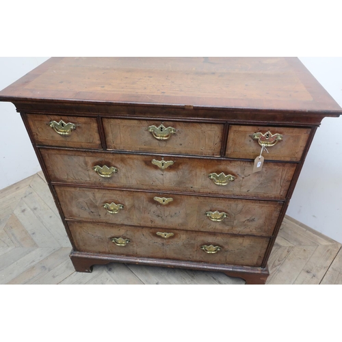25 - 18th C cross and feather banded walnut chest with moulded top above three short and three long drawe... 