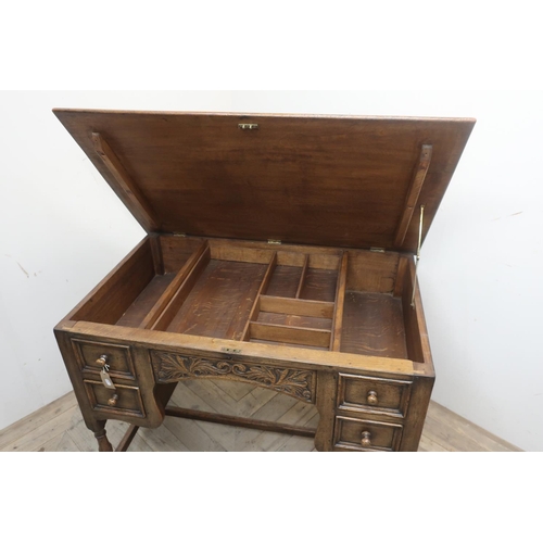 27 - 17th C style oak kneehole desk, hinged top with fitted interior above two real and two faux drawers ... 
