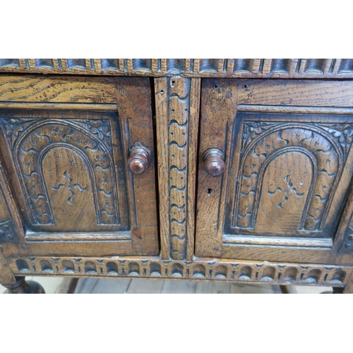 29 - Small 17th C style oak court cupboard, with lunette carved frieze and arch panel door with baluster ... 