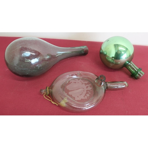 142 - An early 19th C free blown green glass baby feeder (L19cm), a green glass mallet shaped bottle and a... 