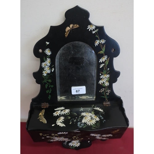 67 - Edwardian lacquer wall tidy with bevelled arch mirror plate, painted with flowers (32cm x 25cm)