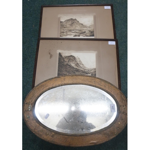 117 - Arts & Crafts style oval bevelled edge mirror, the beaten copper brass frame with rib and bow decora... 
