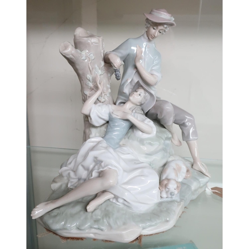 2 - Lladro porcelain group of lovers eating grapes, on naturalistic base with a dog (H27cm)