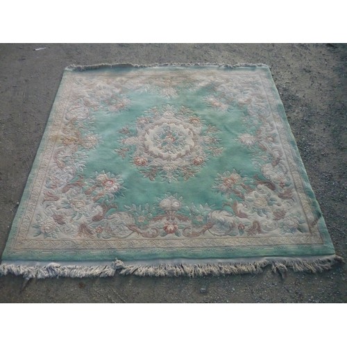 120 - 20th C chinese embossed woolen rug, green ground central floral medallion and floral pattern border ... 