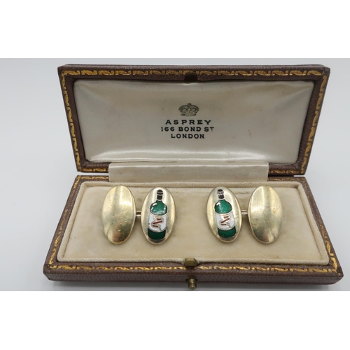 102 - Pair of silver gilt hallmarked cuff-links, enamelled with a green bottle, with an Asprey 166 Bond St... 