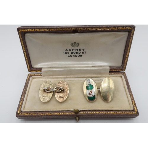 102 - Pair of silver gilt hallmarked cuff-links, enamelled with a green bottle, with an Asprey 166 Bond St... 